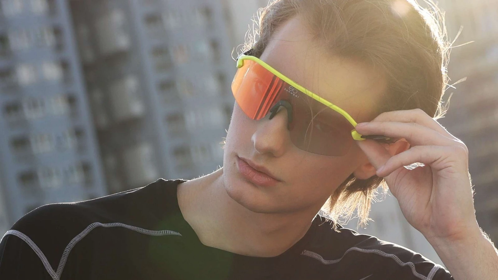 A model wearing EO Sunwear Sports Contador Sunglasses