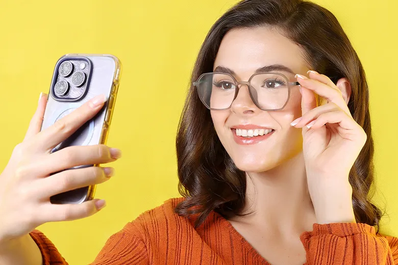 a model using mobile phone while wearing eyeglasses
