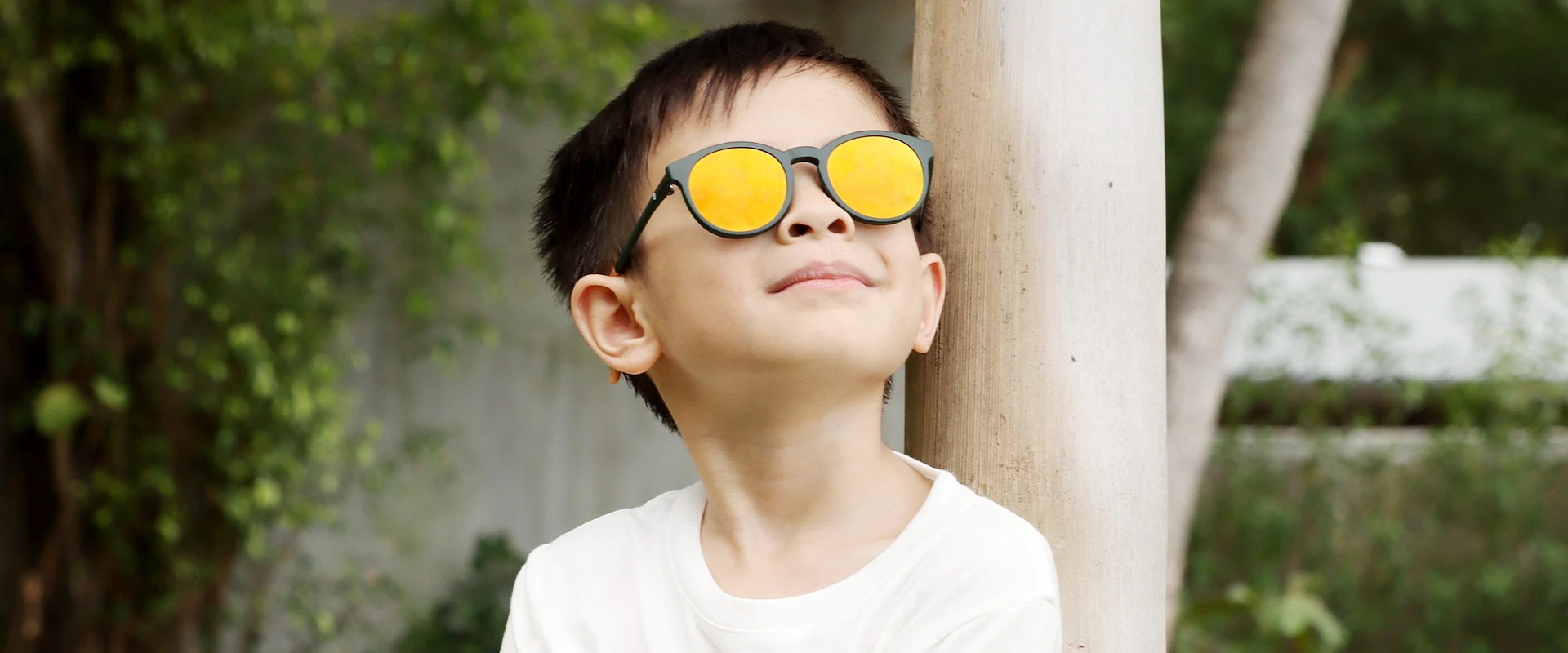 a kid wearing sunglasses